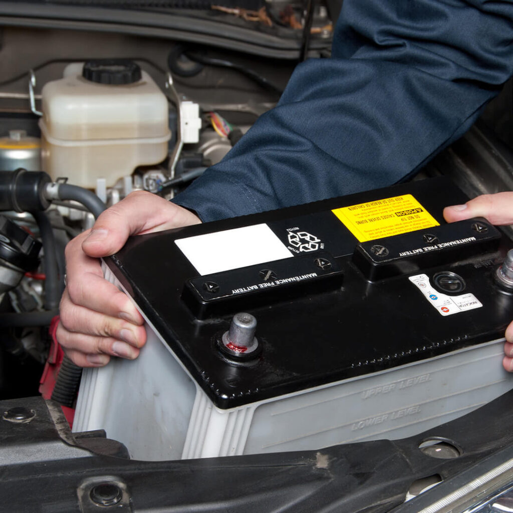 a car battery being replaced