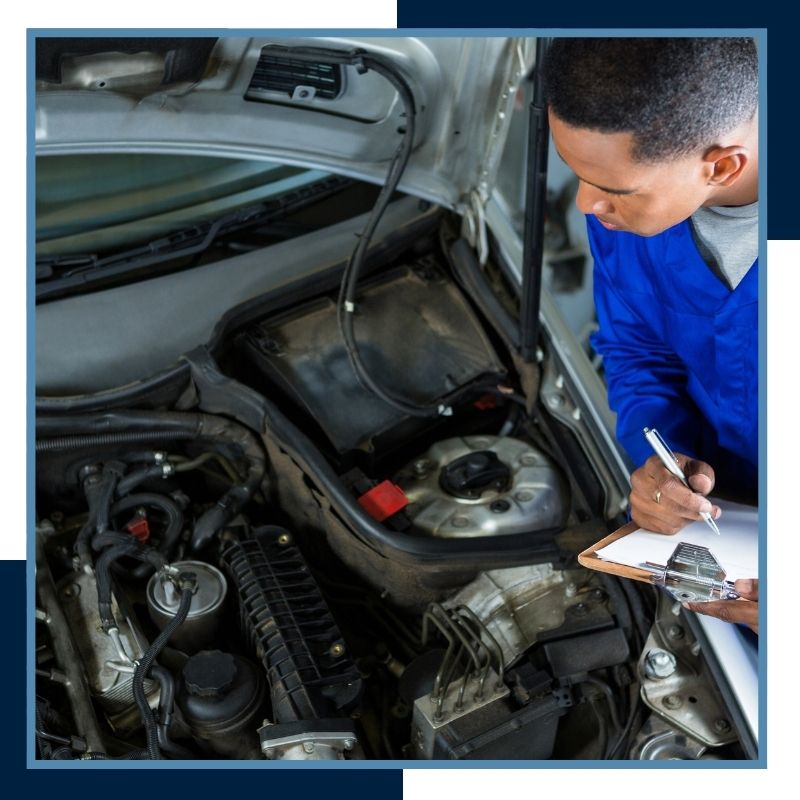 mobile mechanic looking in car